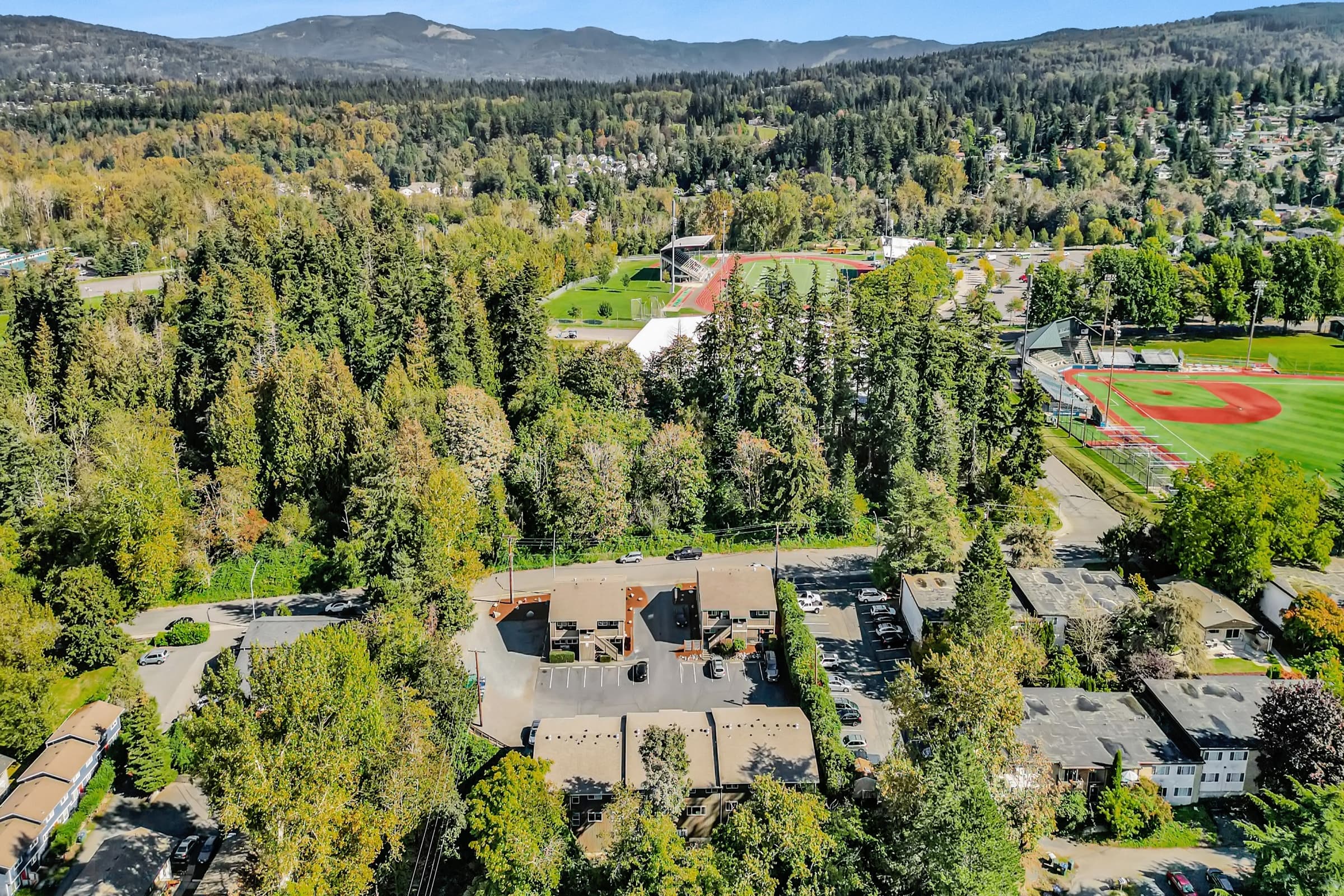A Pacific Northwest multifamily rental property with cedar siding and landscaped grounds